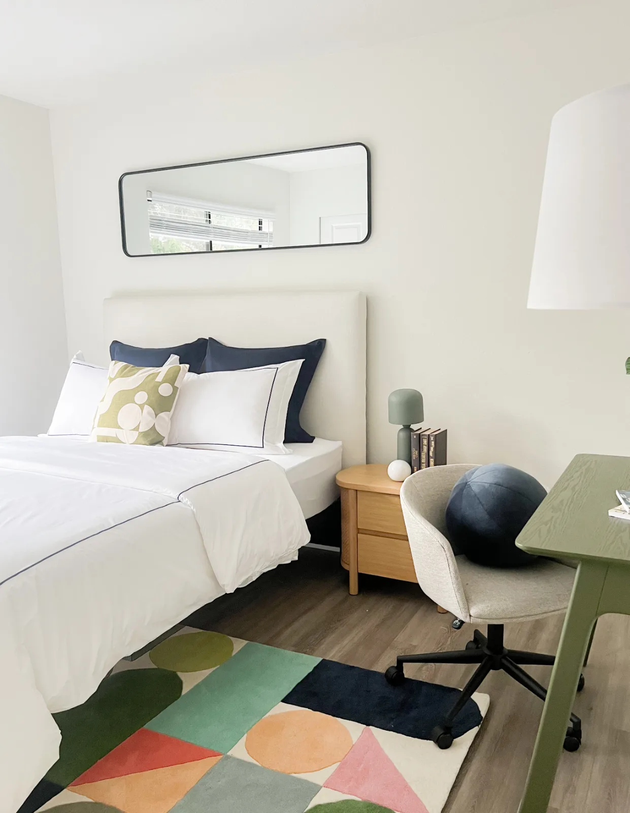 Model residence bedroom suite at The Park in Bellevue with desk and modern furnishings