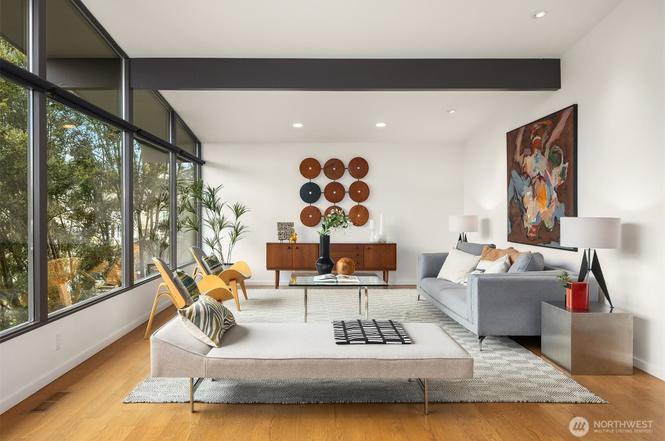 Mid-century modern living room with tailored sofa, daybed, and picture windows