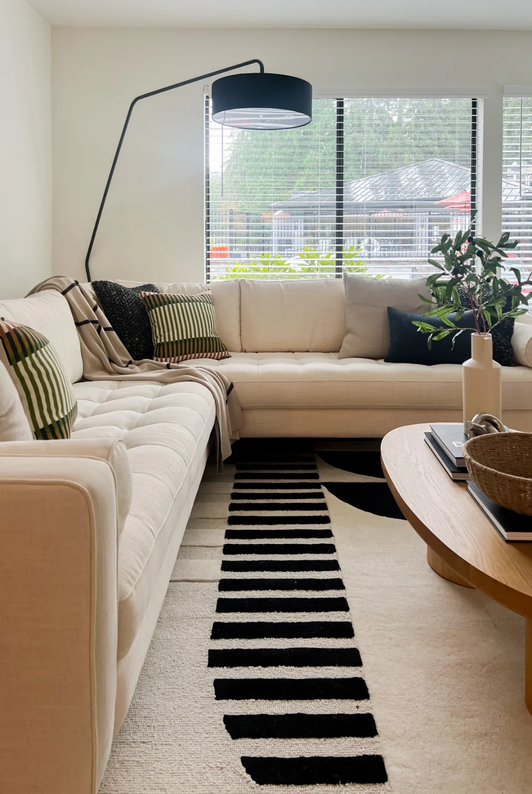 The Park in Bellevue: Bright living room with cream sectional and light wood coffee table