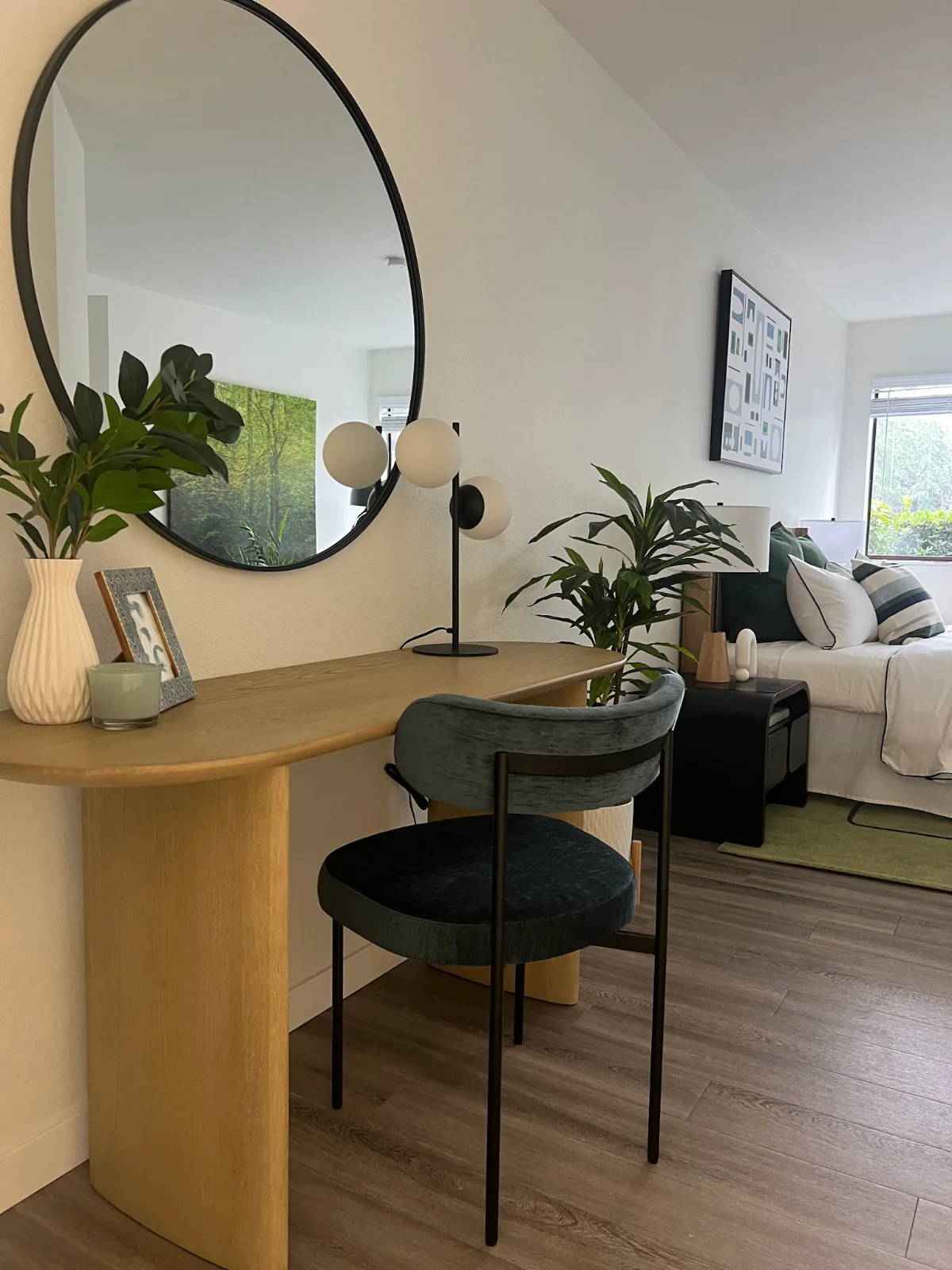 The Park in Bellevue: Curved oak desk and emerald velvet chair close-up