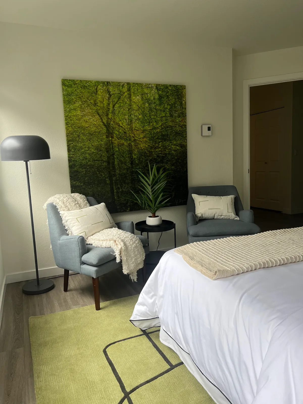 The Park in Bellevue: Bedroom seating nook with slate blue armchairs