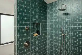 Magnolia walk-in shower with teal geometric tile