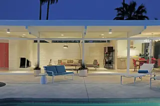 Illuminated mid-century modern patio at twilight