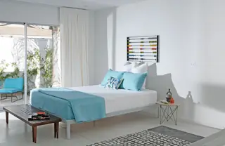 Minimalist bedroom with light blue accents