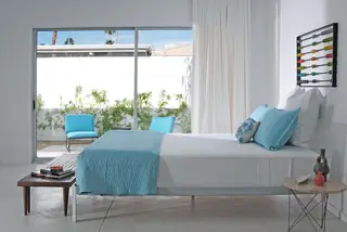 Modern bedroom with sliding glass doors