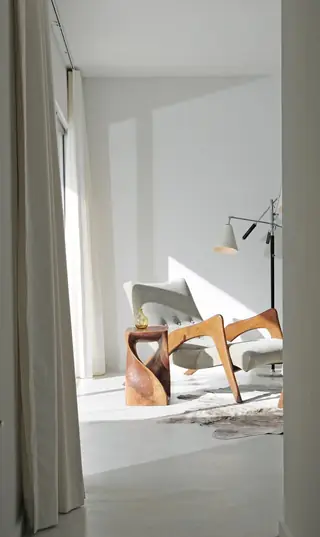 Bright minimalist corner with armchair