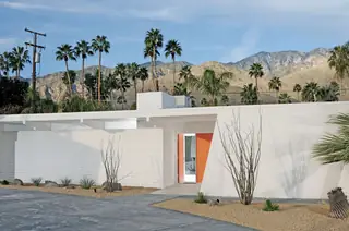 Mid-century modern residence with orange entry door