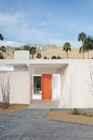 Mid-century modern desert home with white facade