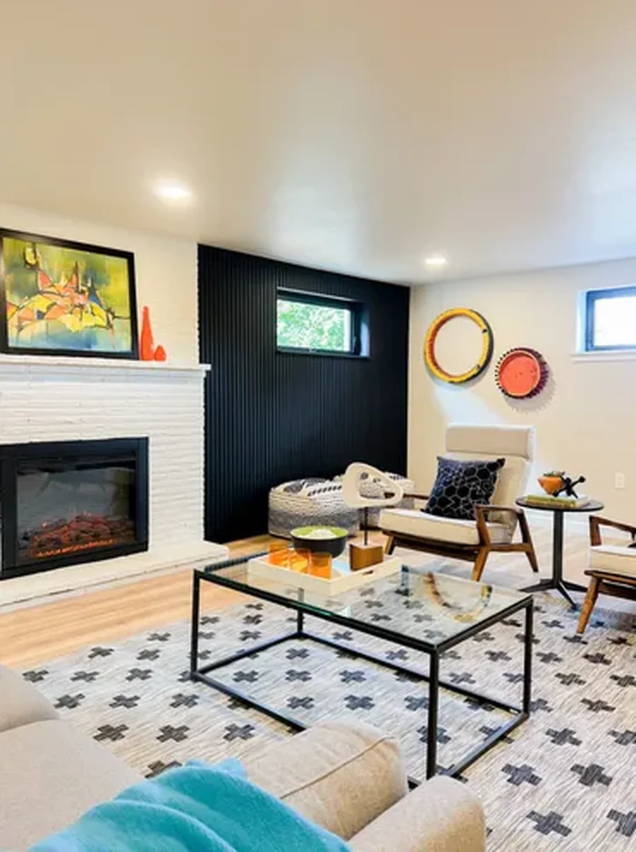Staged living room with a dramatic fireplace